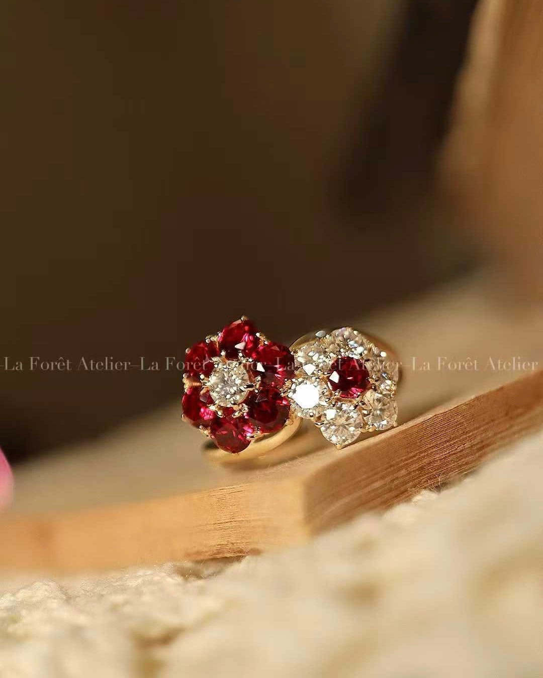 Open floral ring with lab-grown rubies and diamonds in solid gold setting
