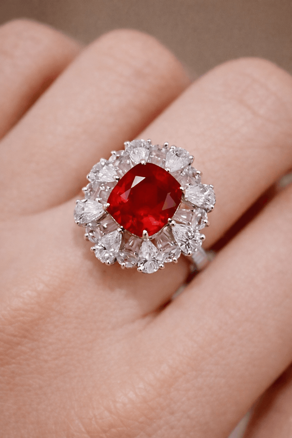 Selvianne Ring with a red gemstone and diamond-like stones on a hand