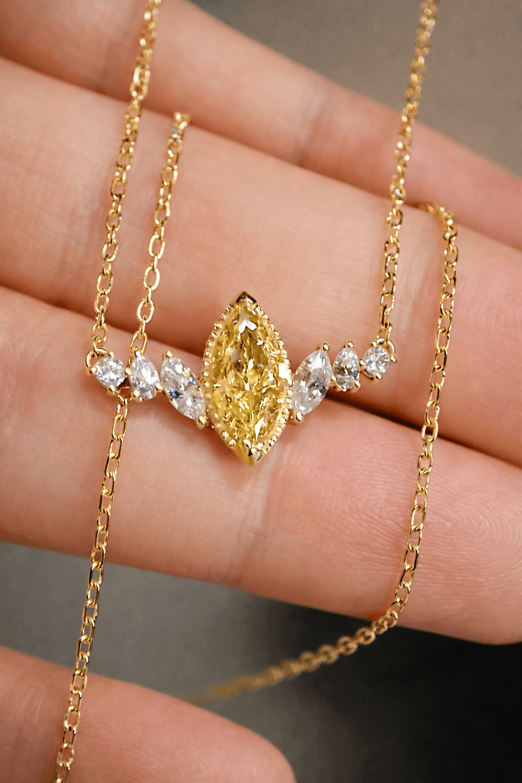 Marquise yellow diamond necklace with white accents
