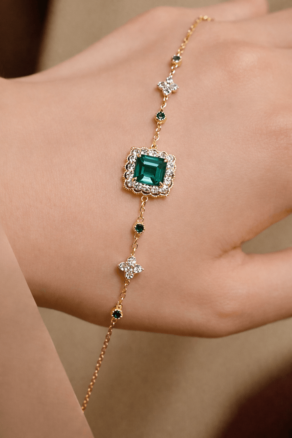 Lymera bracelet with 1.2ct lab grown emerald and diamond accents on a gold chain
