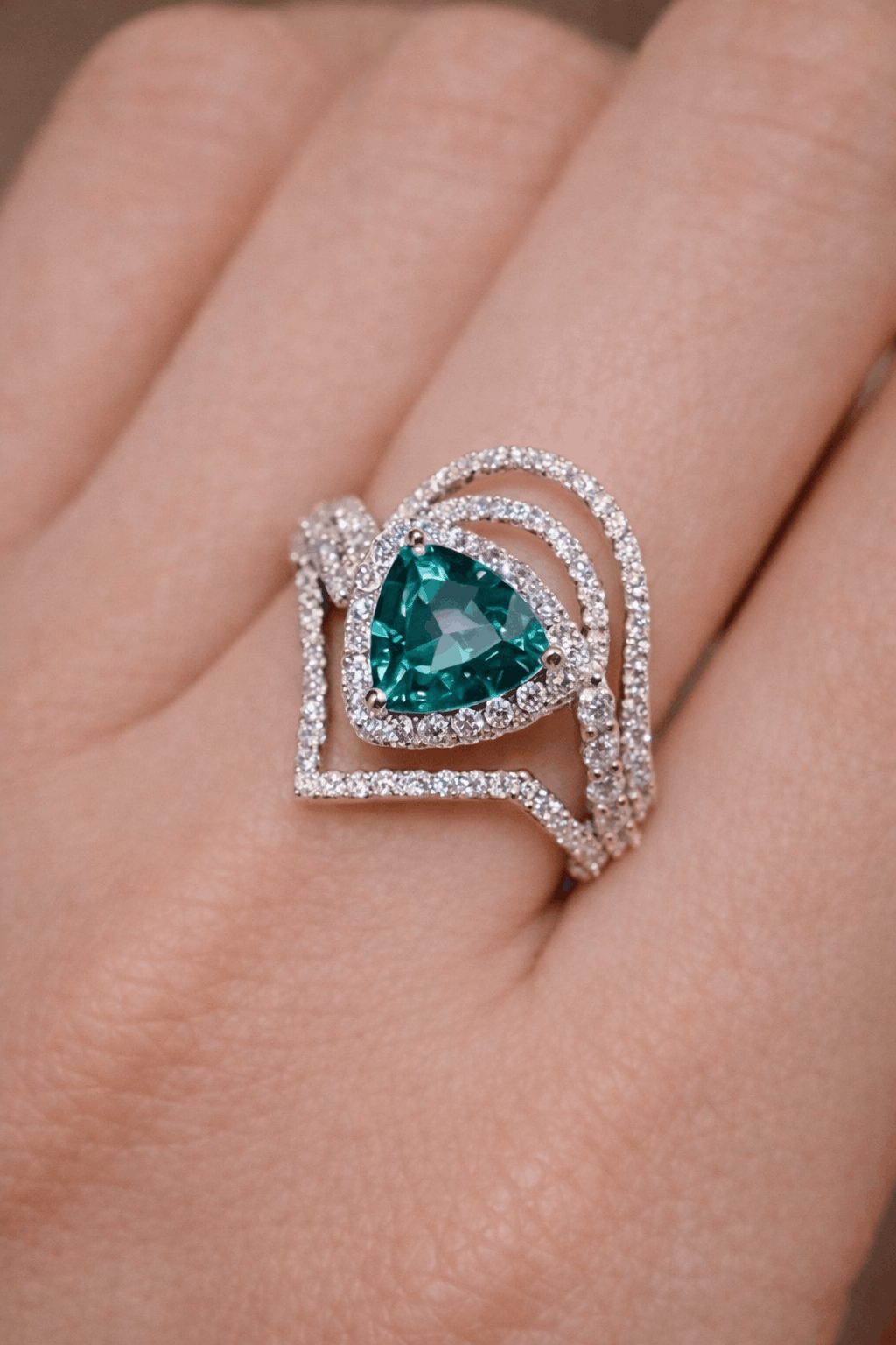 Discover the Elarin ring featuring a 2ct lab-grown paraiba in trillion cut with diamond drape halo—bold, modern, and radiant.
