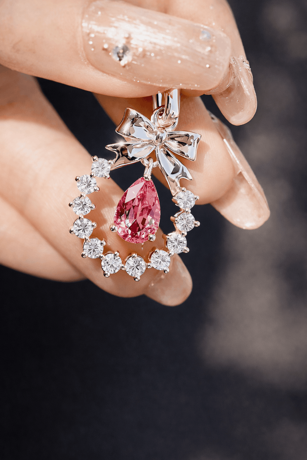 Rose gold bow pendant with pink Padparadscha sapphire
