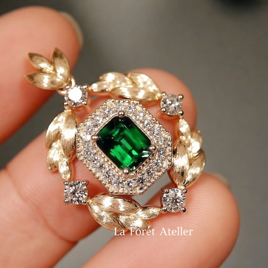 Green tsavorite garnet pendant with lab diamond halo

