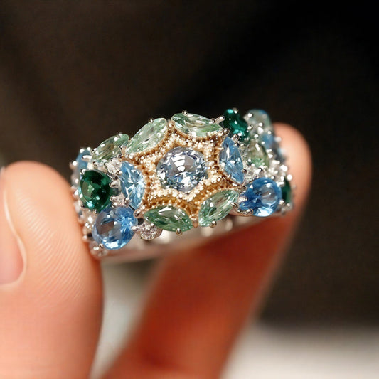 Mosaic floral ring with lab aquamarine, emerald, and tourmaline

