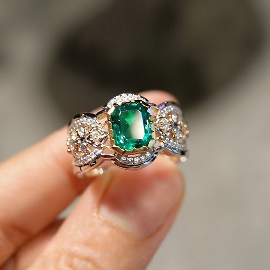 Lab-grown emerald eternity ring with scroll diamond band

