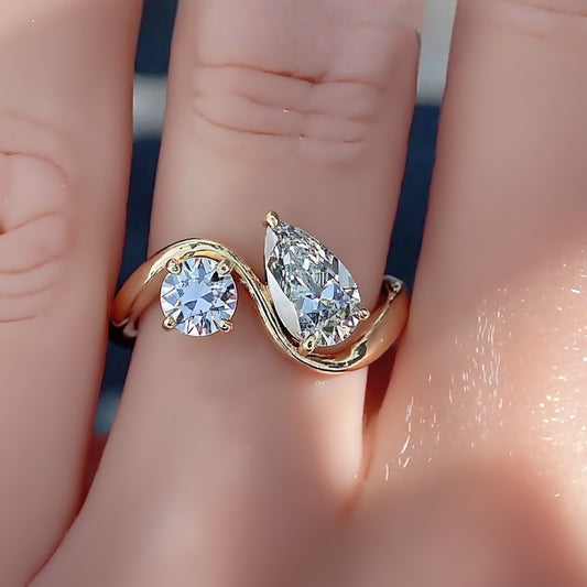 Two-stone bypass ring with lab-created pear and round diamonds


