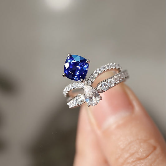 Lab sapphire and diamond bow ring with double band

