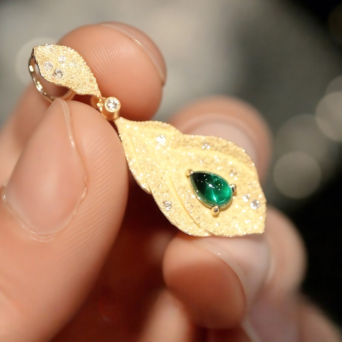 Sorrel gold leaf pendant with lab emerald and diamond accents

