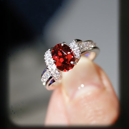 Close-up of 2ct lab ruby ring with diamond accents

