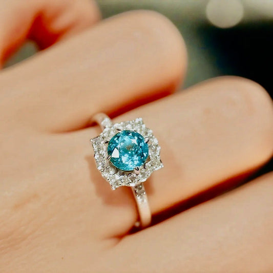 Azure Bloom Ring with 7mm round Paraiba center stone
