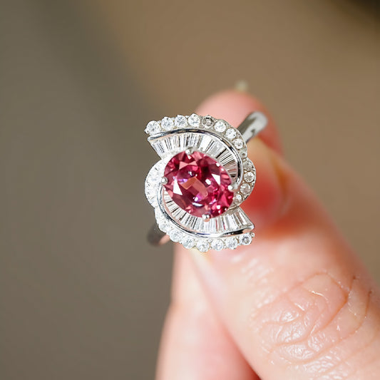 2 carat lab-grown padparadscha sapphire halo ring with baguette diamonds


