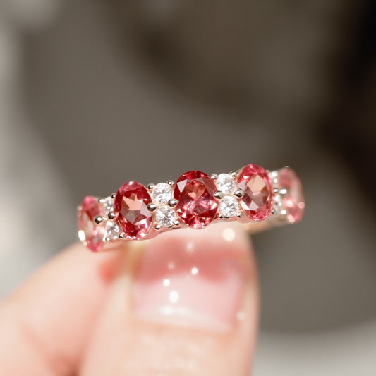 Lab-grown padparadscha sapphire eternity band with white diamonds


