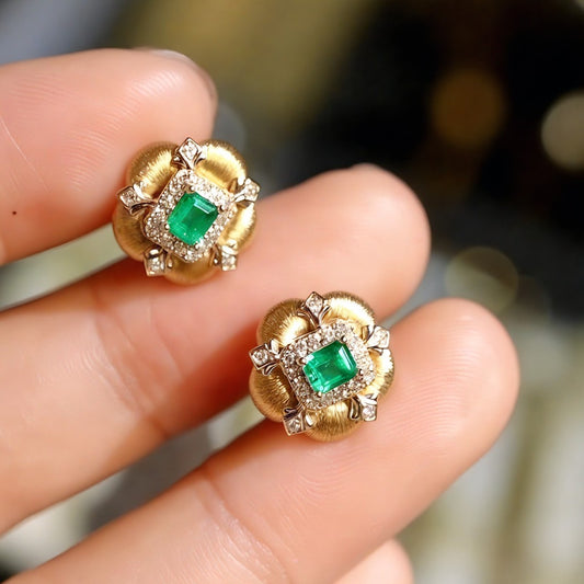 Vintage gold stud earrings with lab emerald centers and diamond accents








