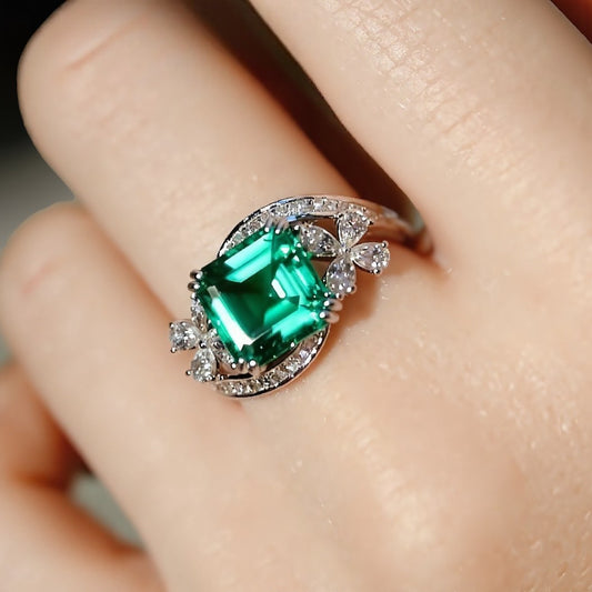 Vintage swirl ring with lab-grown emerald and floral diamond accents








