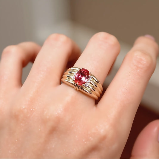 Gold ring with 2ct lab padparadscha sapphire and ribbed band design








