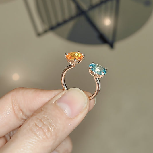 Solari open ring with orange Fanta garnet and blue paraiba tourmaline in gold setting








