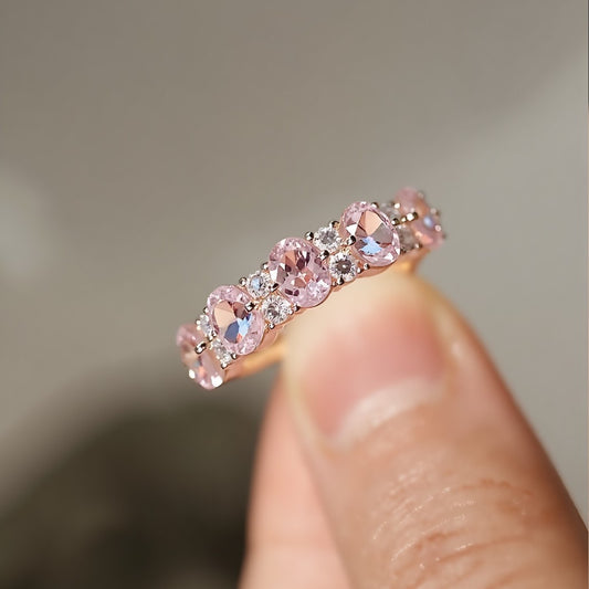 Aureline rose gold ring with alternating lab pink and white diamonds in an eternity style








