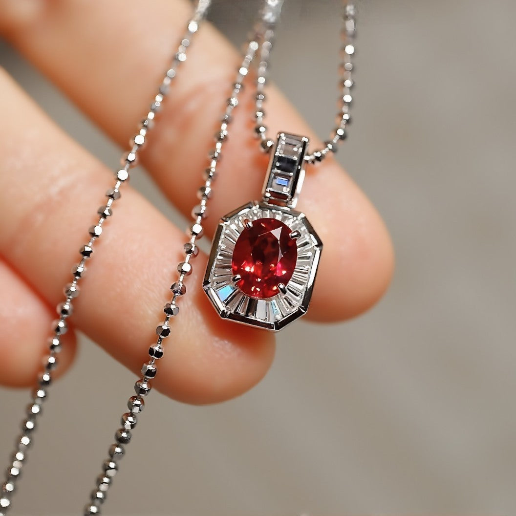 Lab-created ruby pendant with baguette diamond halo

