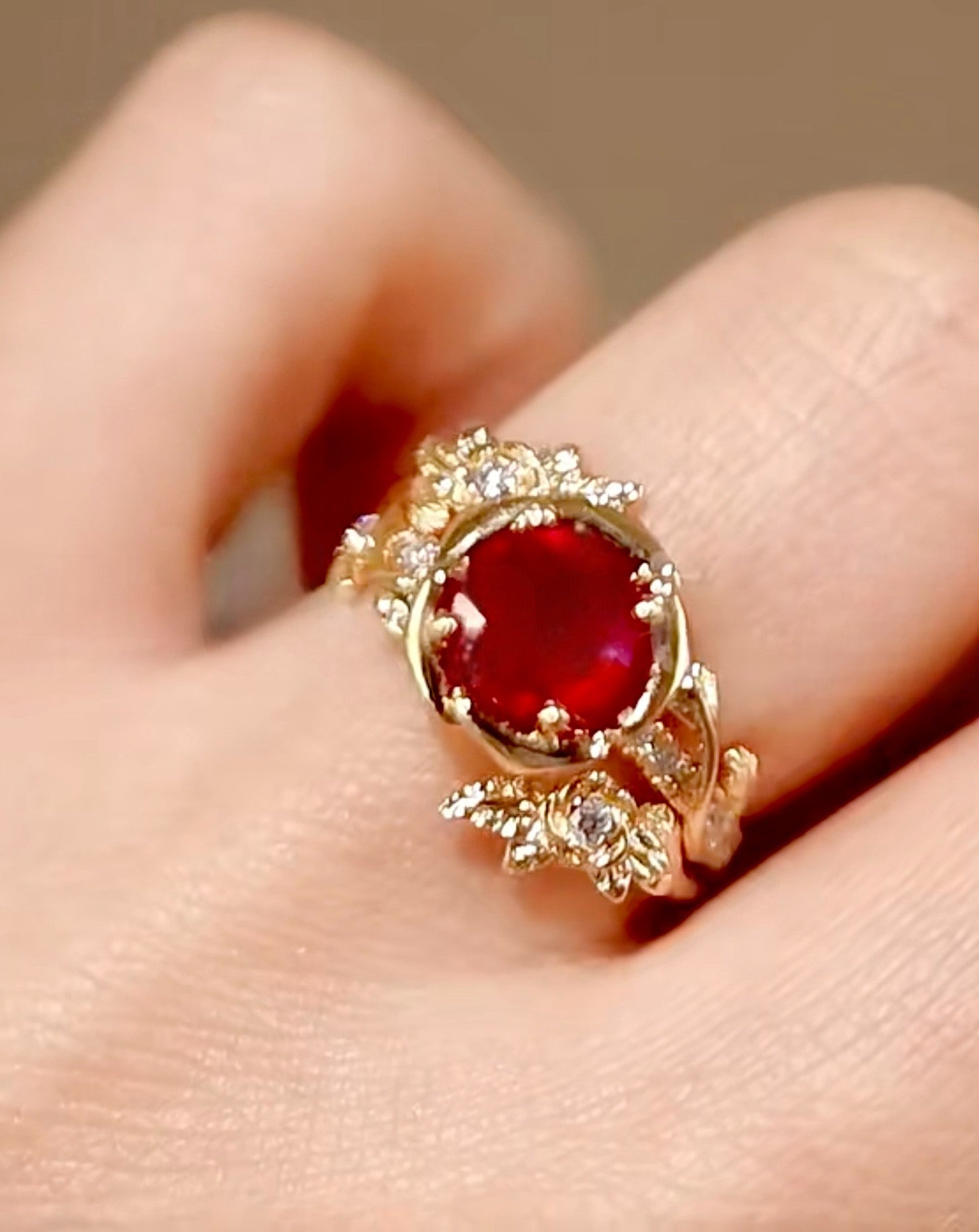 Valtira ring with 1.5ct lab-grown ruby and floral diamond-accented gold setting