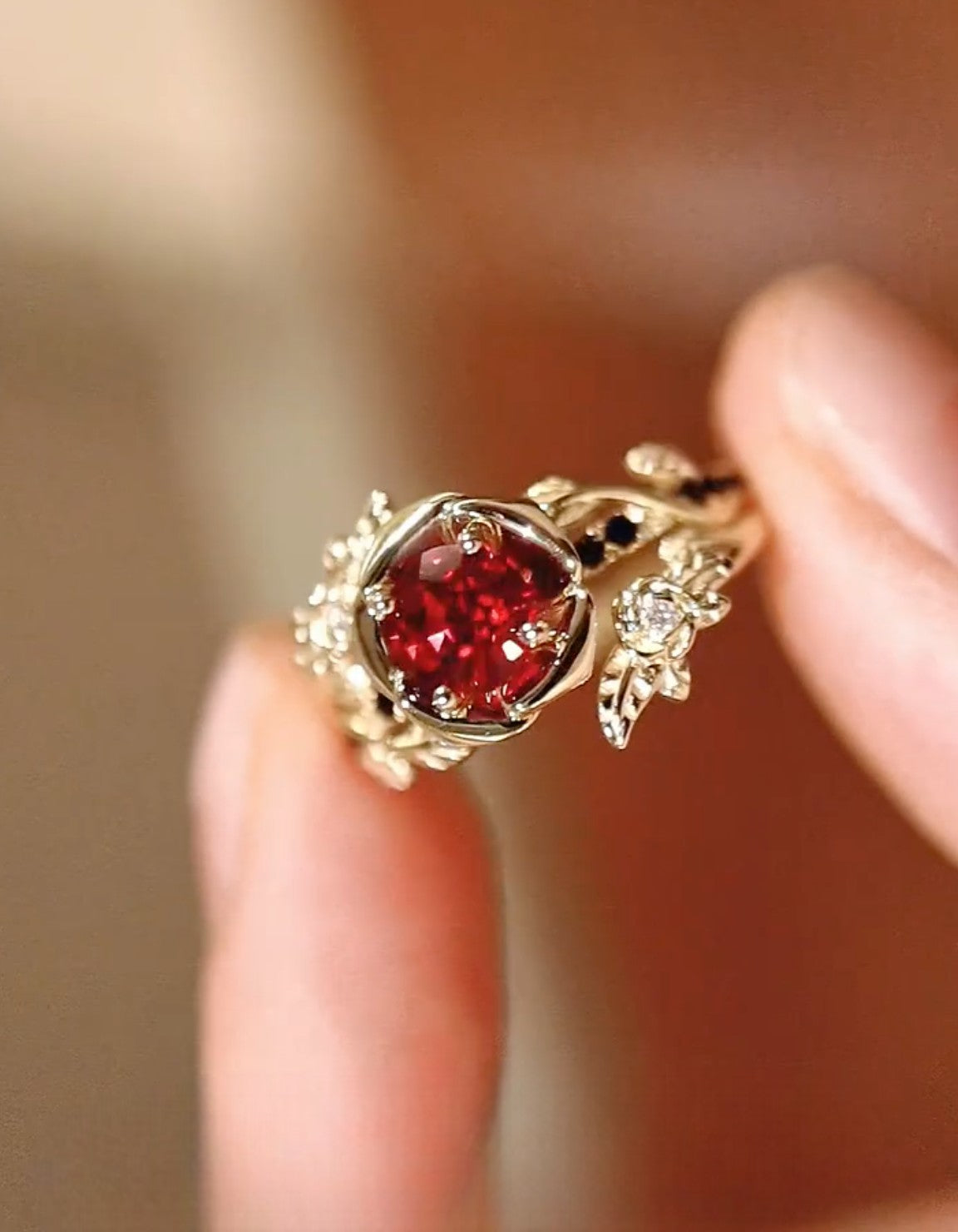 Clarionne ring with 1ct lab-grown ruby in a sculpted floral bezel and diamond vine accents in gold – romantic vintage-inspired fine jewelry

