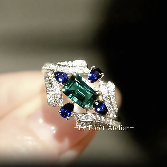 Art Deco emerald and sapphire ring with lab diamond accents

