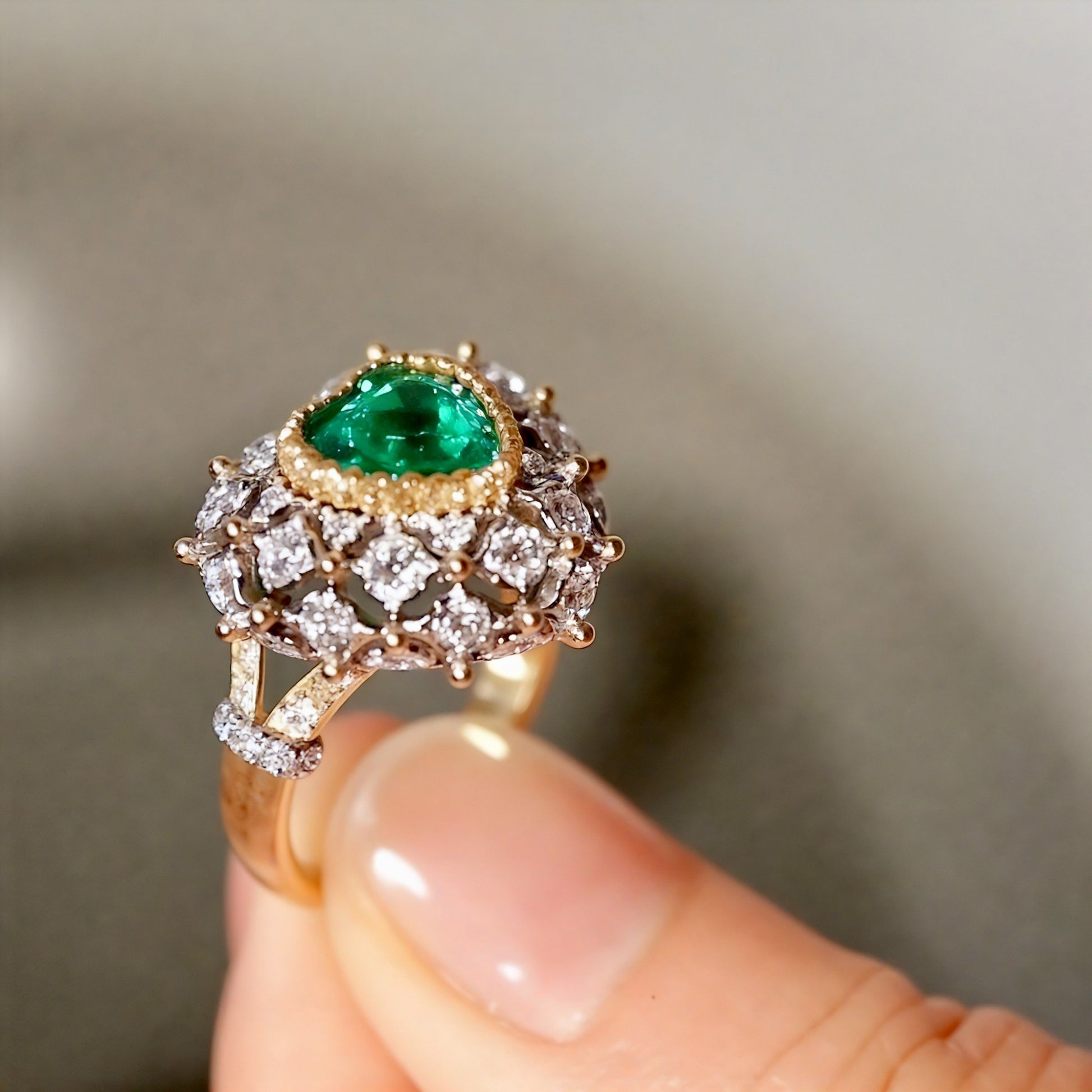 Heart-cut emerald dome ring with lab diamonds
