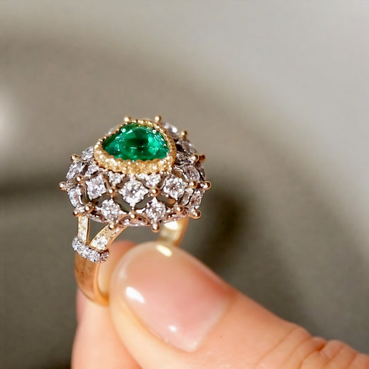 Heart-cut emerald dome ring with lab diamonds
