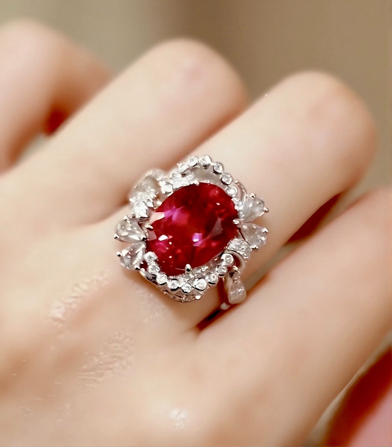 Solmira ring showcasing a 7ct lab-grown ruby with a halo of lab diamonds