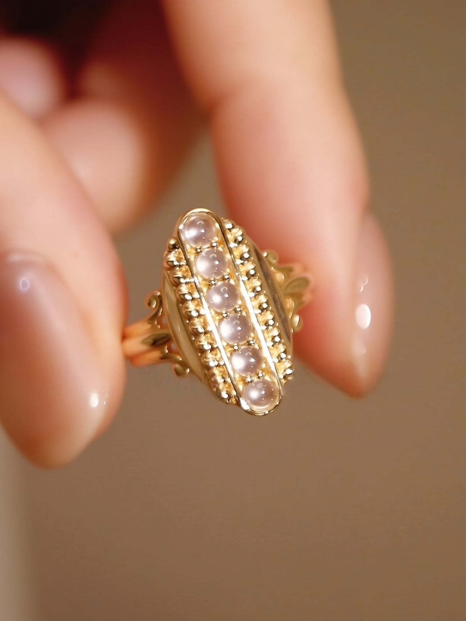 Nyselle gold ring with jade cabochons and vintage bead detailing








