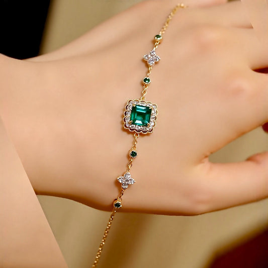 Lymera bracelet with 1.2ct lab grown emerald and diamond accents on a gold chain

