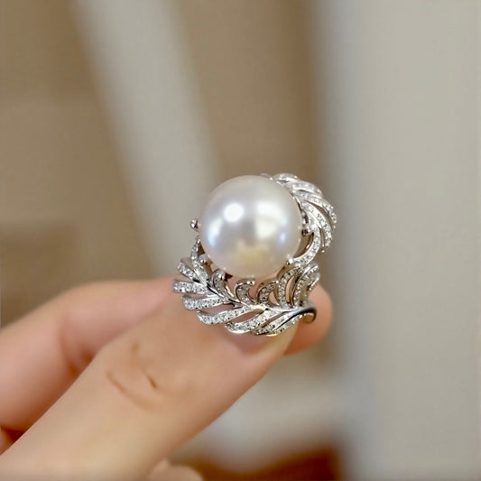 Natural pearl ring with 12–13mm white pearl and diamond wave leaf setting








