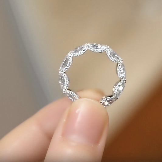 Oval lab-grown diamond eternity band with scalloped setting design








