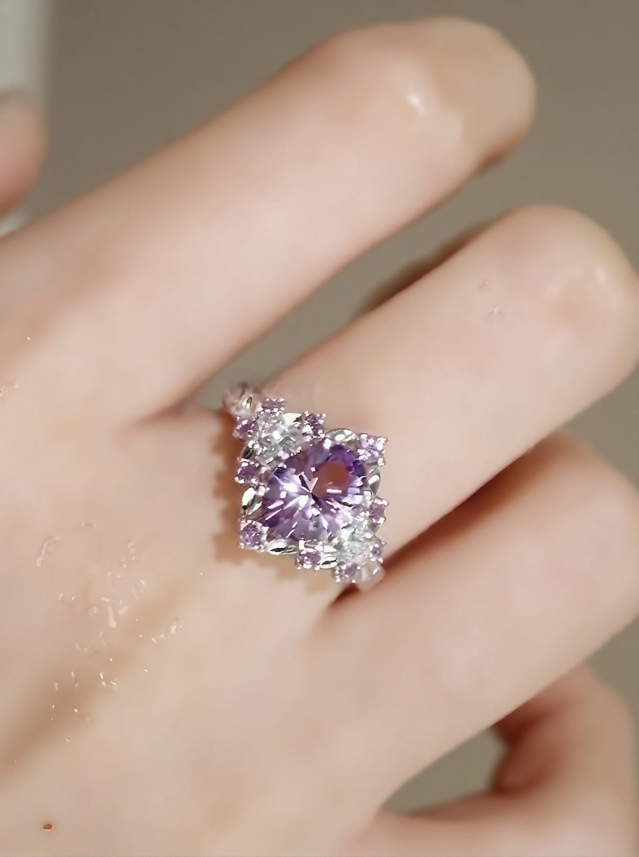 Jaevia ring featuring 1ct lavender lab sapphire with pink sapphires and diamond halo









