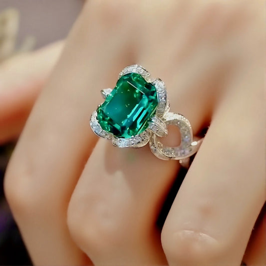 4 carat lab emerald ring with diamond halo

