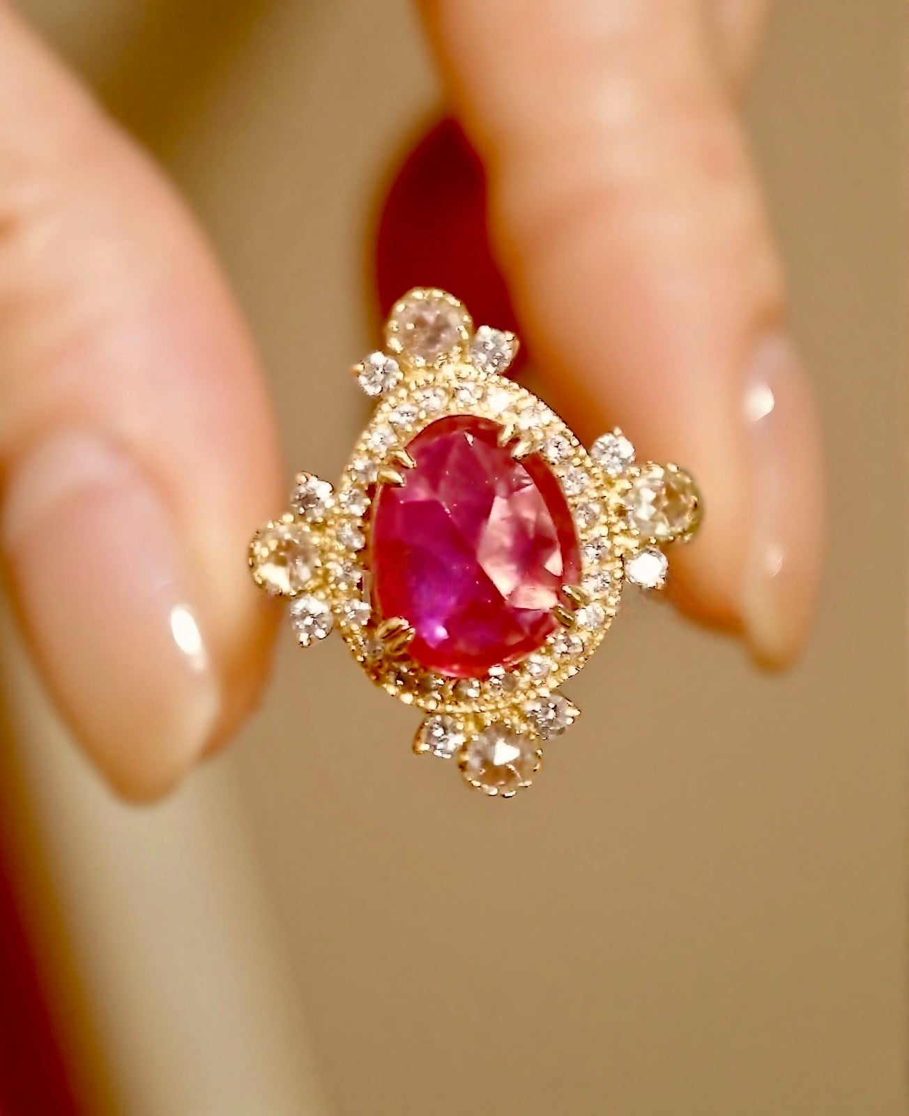 Xantheia 3ct pear lab ruby ring with 4 rose-cut diamonds in gold halo setting