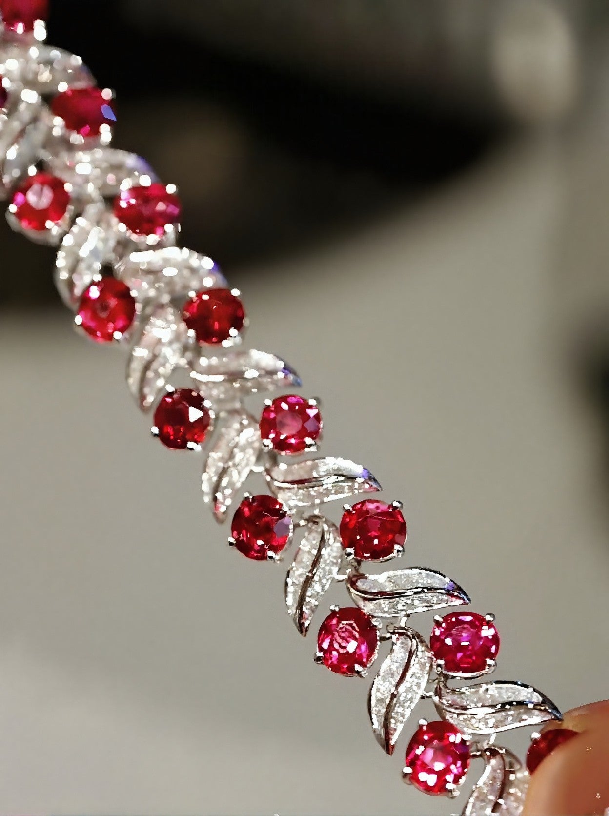 Vespera bracelet with vivid lab-grown rubies and diamond-accented leaf details in white gold – luxurious nature-inspired fine jewelry

