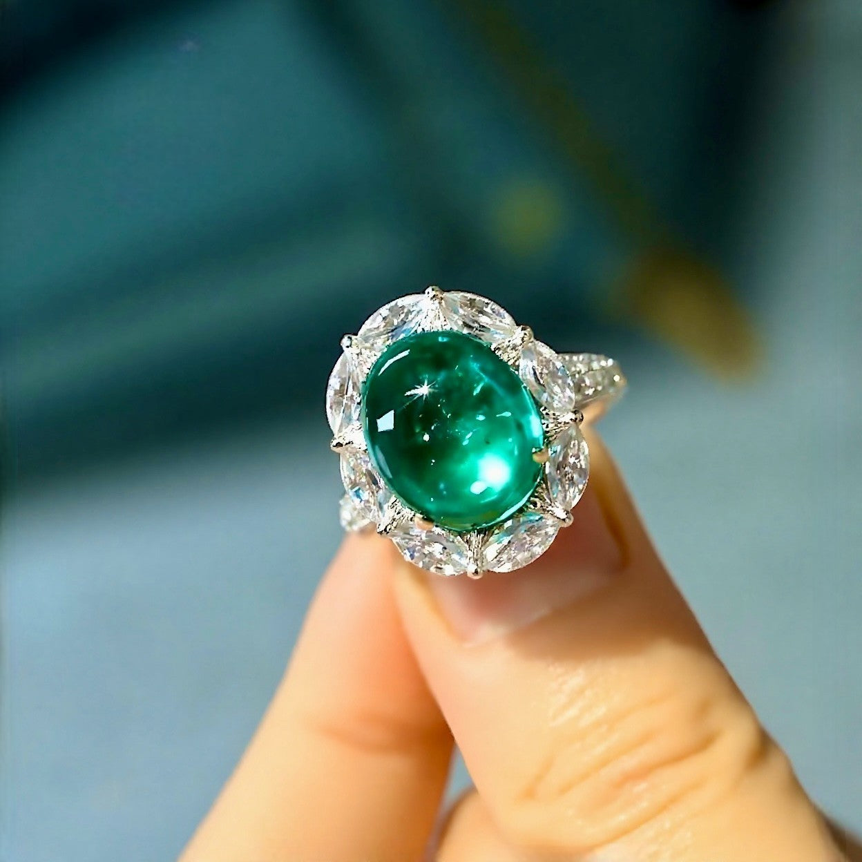 Vaelle ring featuring 5ct lab grown emerald and marquise diamond halo in white gold








