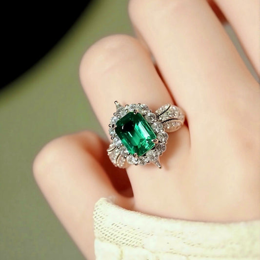 3ct lab emerald halo ring with split shank and lab diamonds in platinum setting

