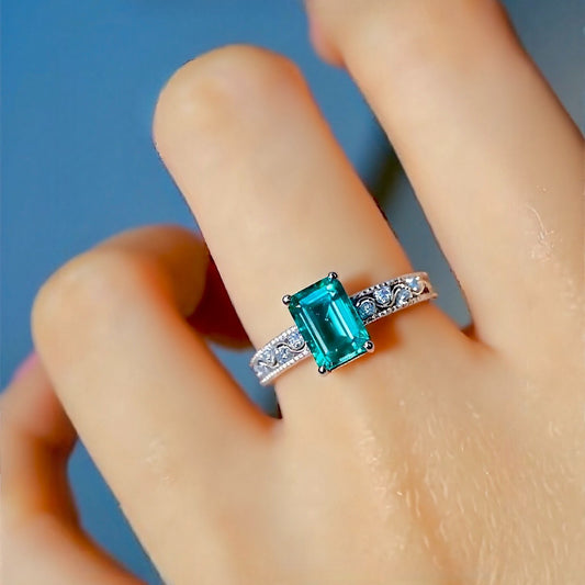 1ct emerald-cut lab emerald ring with diamond band in white gold setting








