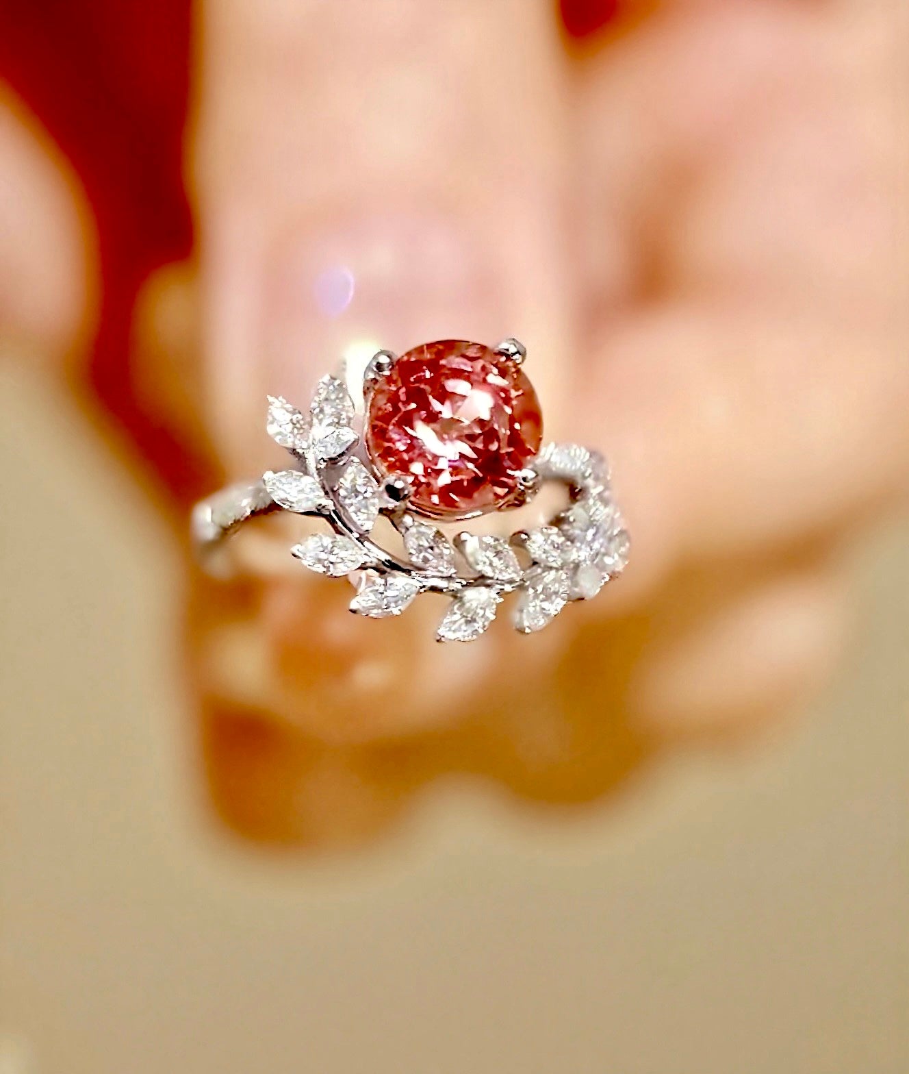 Serelith ring with 2ct lab padparadscha sapphire and diamond leaf band in nature-inspired design