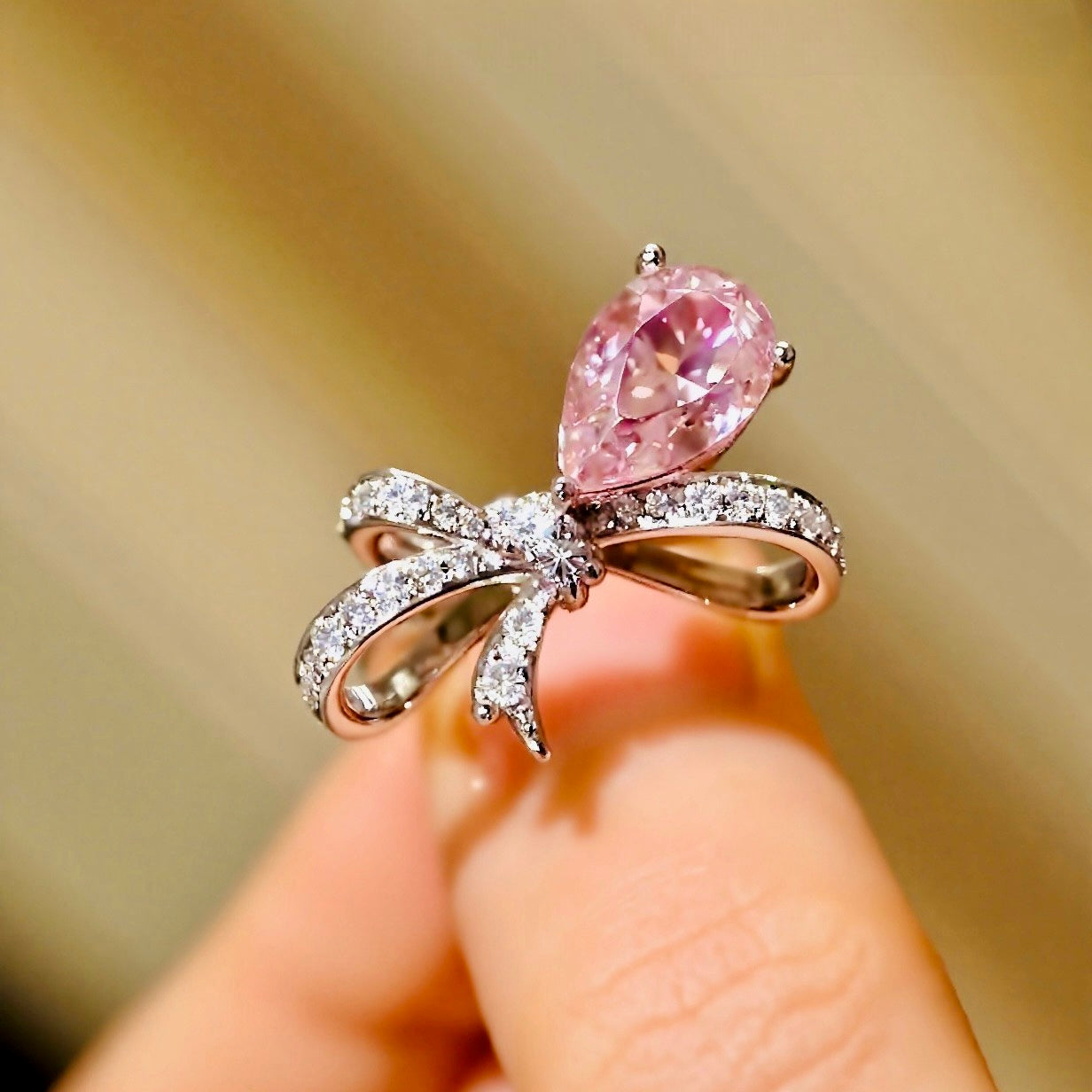 Ondira ring featuring 2ct lab grown pink diamond and pavé bow design in white gold








