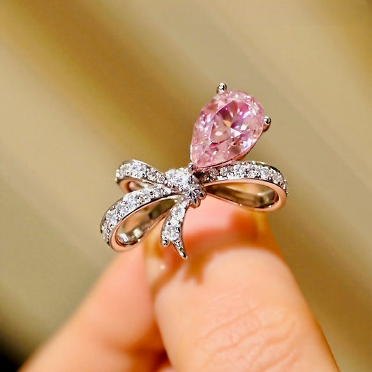 Ondira ring featuring 2ct lab grown pink diamond and pavé bow design in white gold









