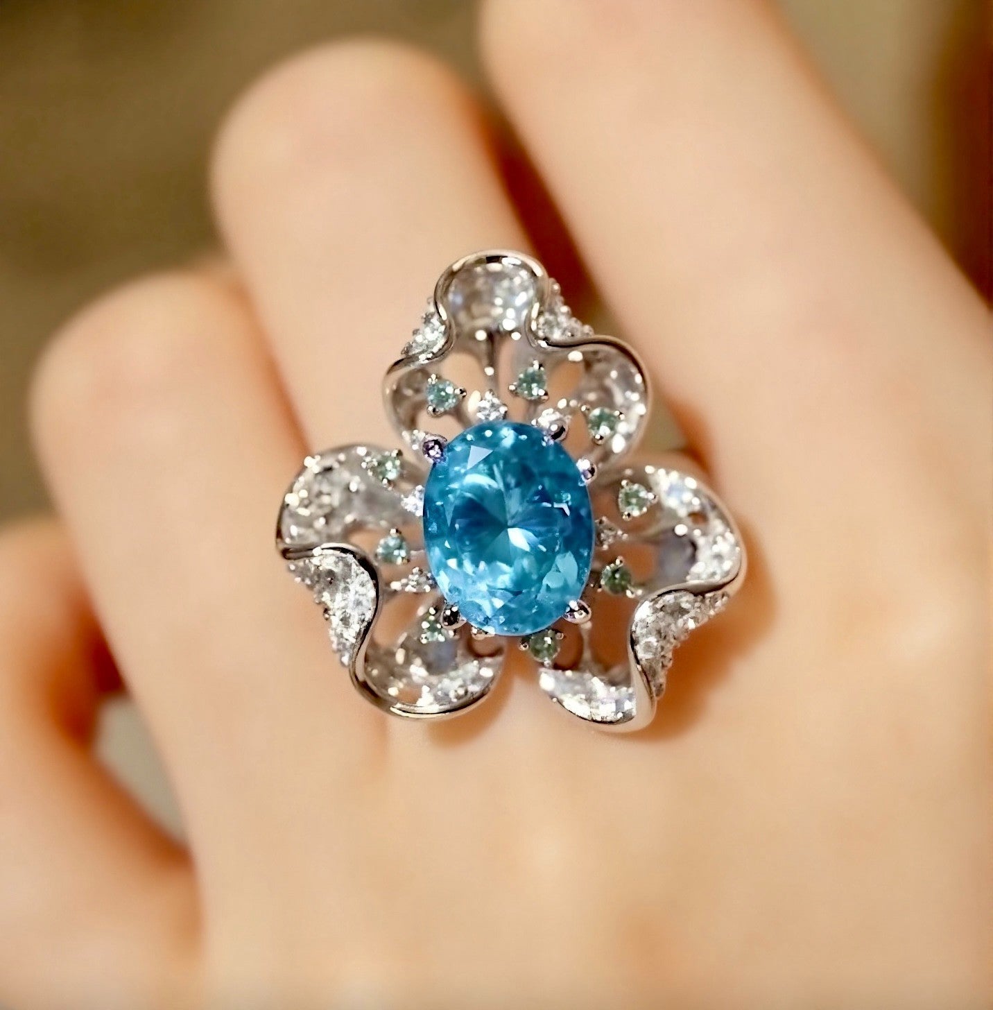 Floral-inspired ring with a 5ct natural apatite center and shimmering diamond petals








