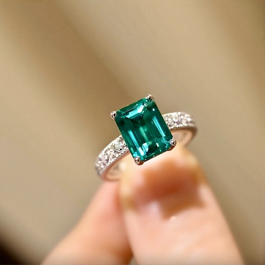Cushion-cut lab-grown emerald ring with pavé diamonds and white gold band
