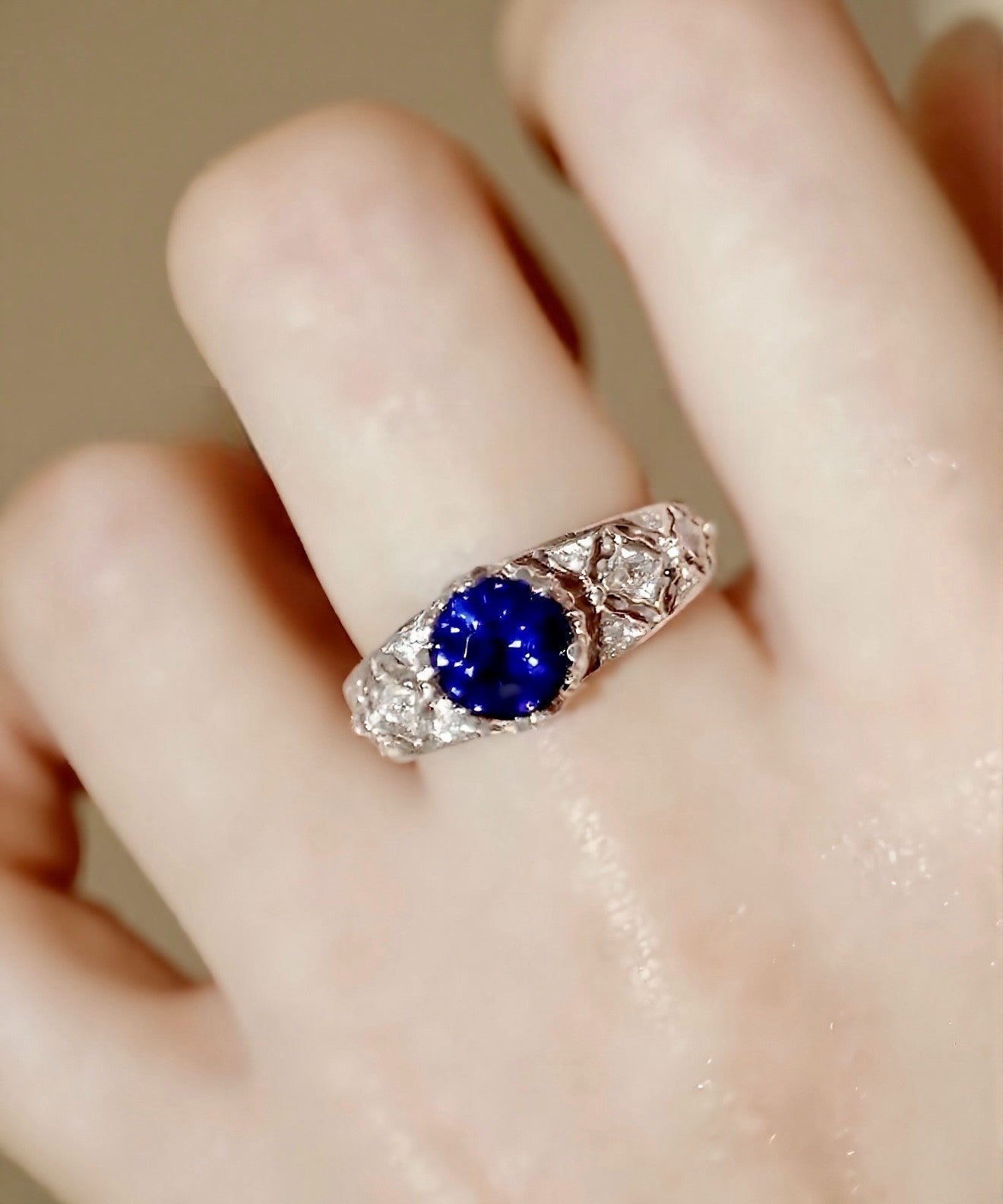 Tiranelle ring featuring 1ct lab sapphire with vintage diamond accents on silver band