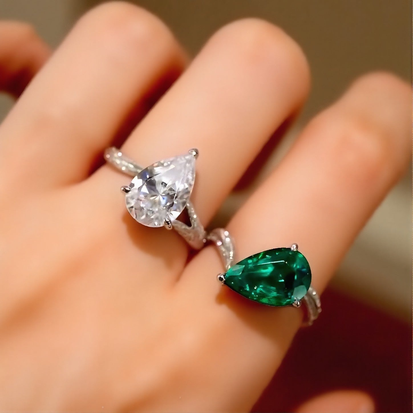 Matching lab-grown emerald and diamond two-ring set in white gold








