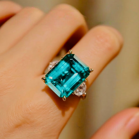 Vaetia ring with 10ct lab grown emerald and side diamonds in gold setting








