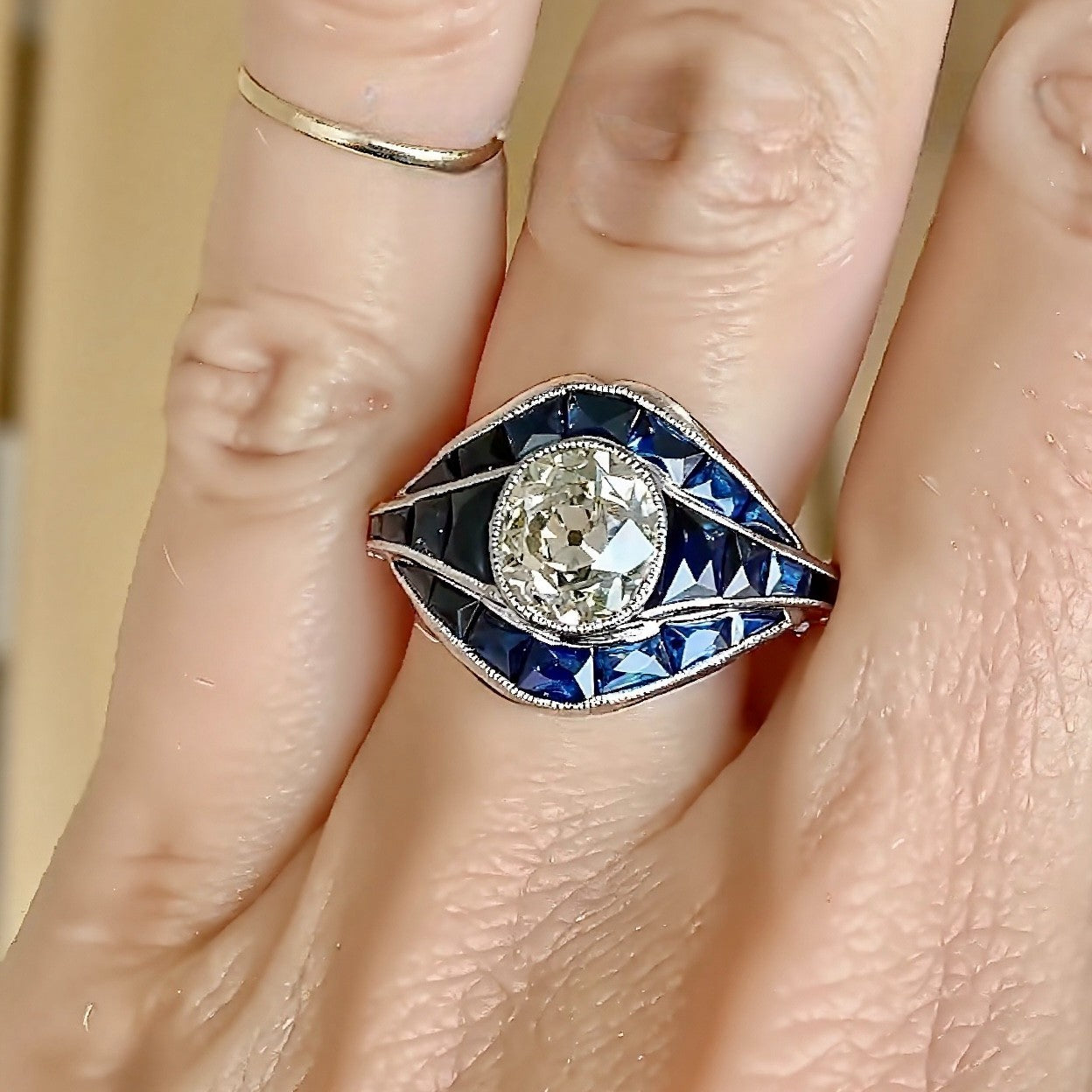 Art Deco lab diamond ring with blue sapphire inlays
