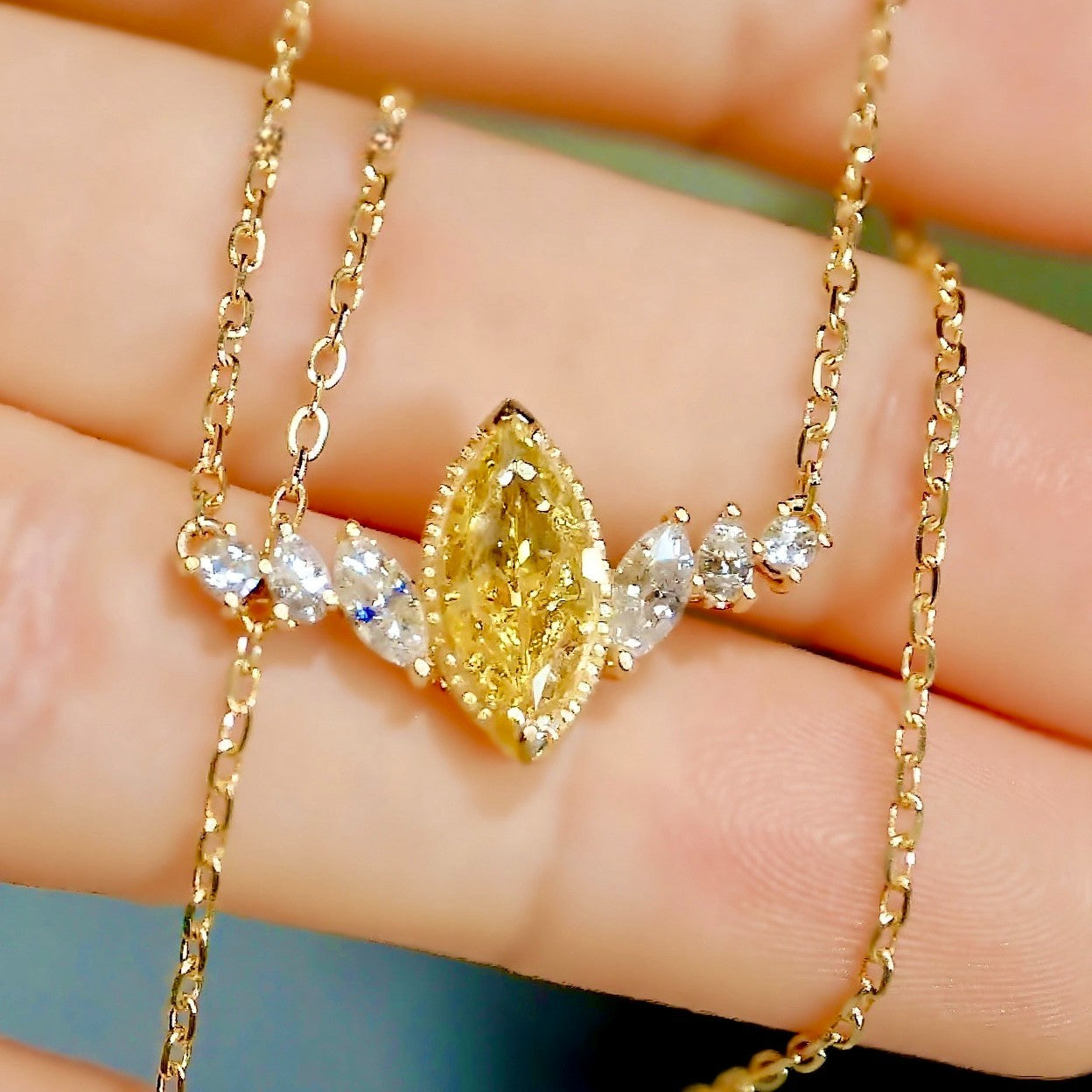 Marquise yellow diamond necklace with white accents
