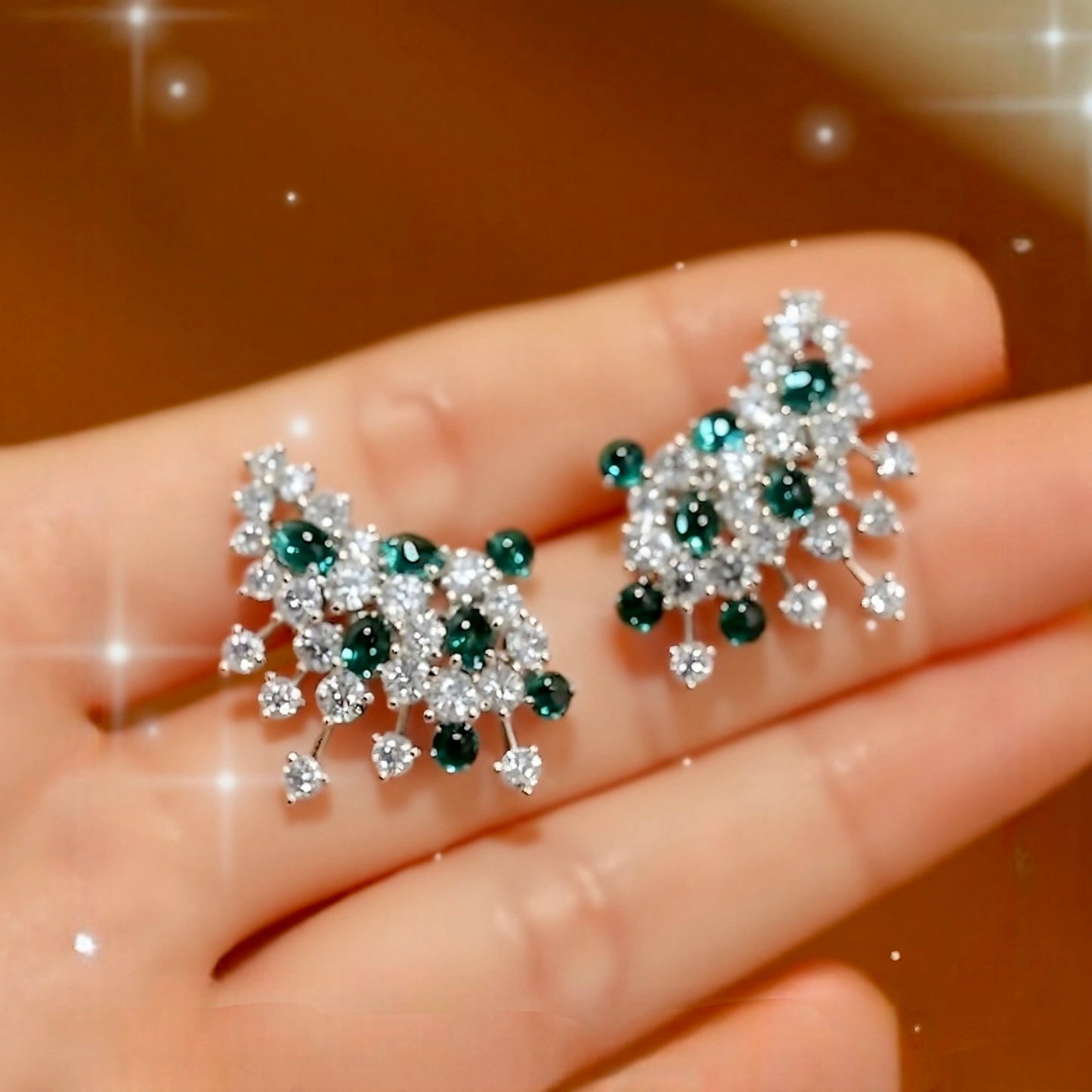 Sylira statement earrings with lab-grown emeralds and diamonds in a white gold floral design








